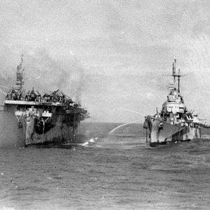 USS Birmingham comes alongside the burning USS Princeton