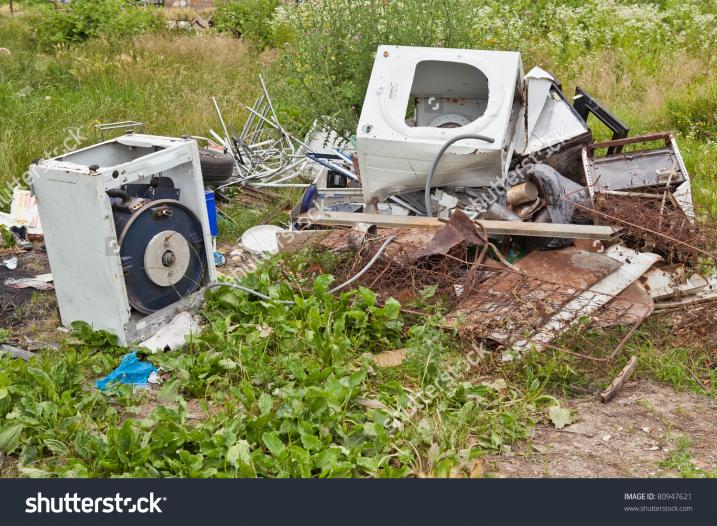 stock photo junk yard with garbage scattered in the field 80947621