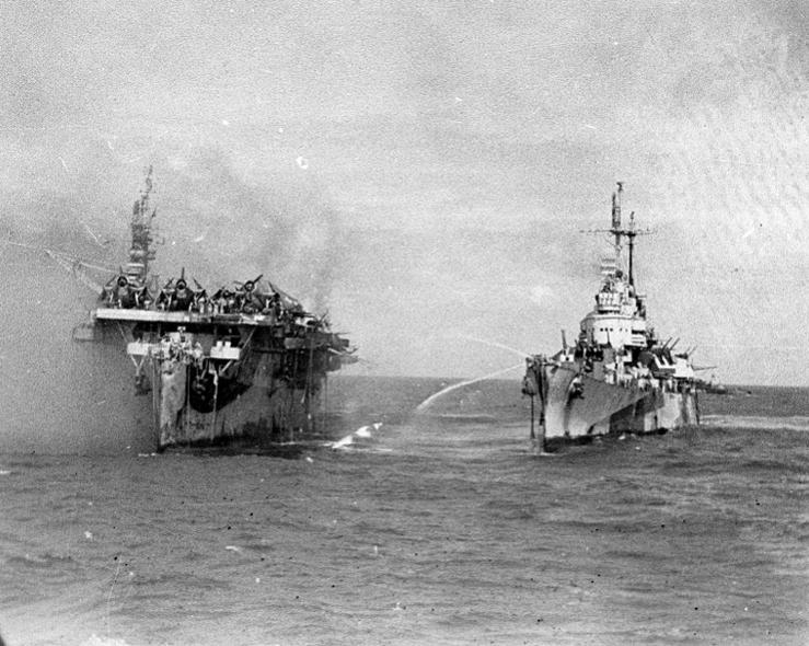 USS Birmingham comes alongside the burning USS Princeton